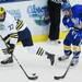 Michigan sophomore Mac Bennett looks to move the puck around Lake Superior State sophomore Colin Campbell in the first period at Yost Arena on Friday night. Melanie Maxwell I AnnArbor.com